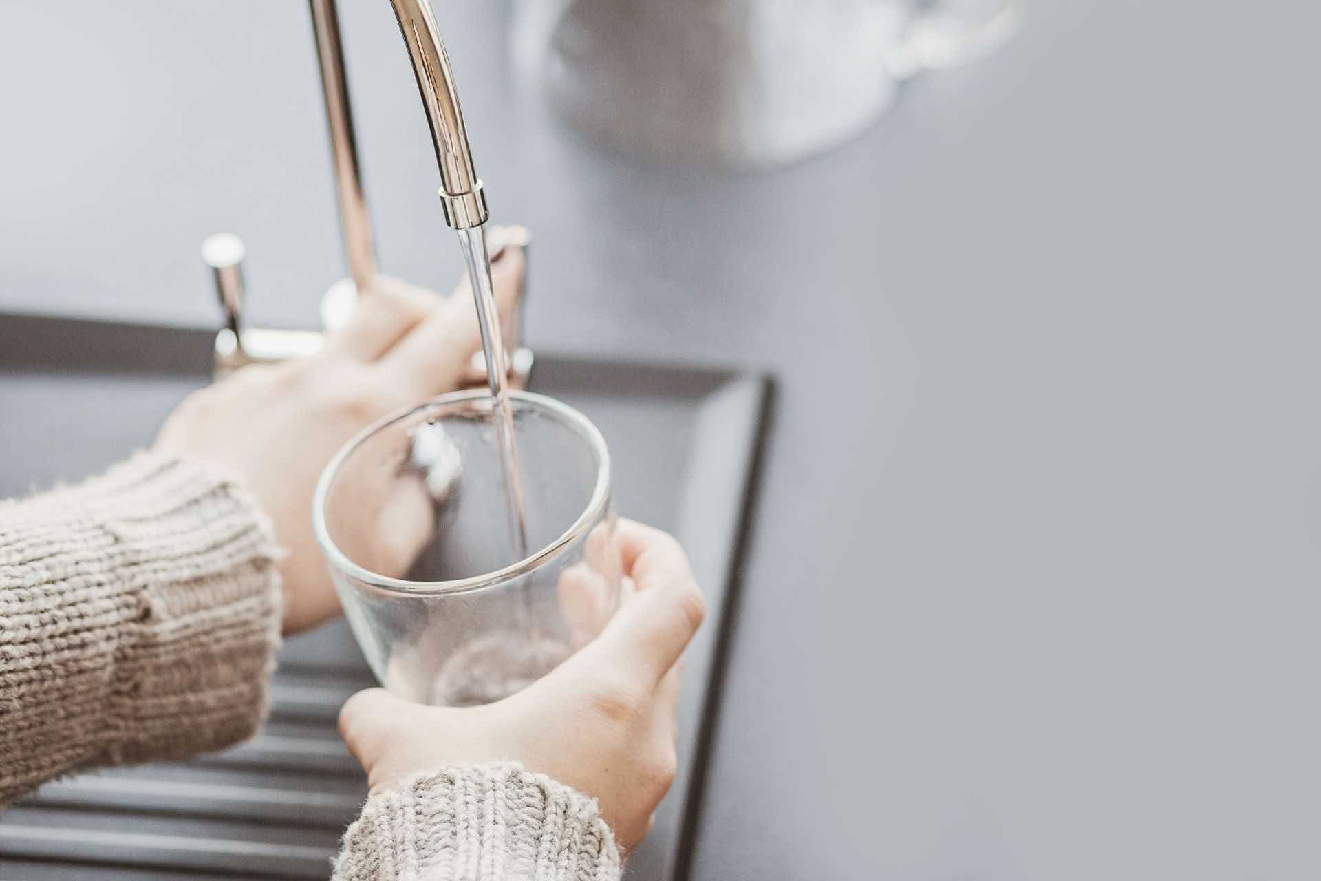 filling glass with tap water